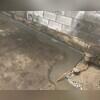WaterGuard is installed along the perimeter of the basement floor and covered in fresh concrete to provide a seamless finished look. The WaterGuard Port is left visible to provide access to the system when needed.