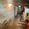 Prior to repairs, you can see the cause for concern. The wall had significantly bowed and there were signs of water intrusion in the basement.