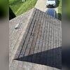 The existing shingles on this roof had blown off.
