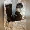 This SmartJack was installed atop a concentric push pier that had been hydraulically driven into competent, load-bearing soil. This approach was necessary due to the planned removal of the surrounding concrete, ensuring that the SmartJack would remain supported independently. The combined use of...