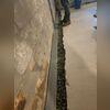 Next, after creating a perimeter trench, our crew carefully placed WaterGuard inside before surrounding the system with clean washed stone and applying a layer of cement to conceal and protect.