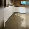 Our WaterGuard drainage system is installed below the floor, around the entire perimeter of the basement. It is what's under the new, wet cement seen here that will soon dry. Our CleanSpace vapor barrier is installed on half the wall and will help direct water into the drains while also protecting...