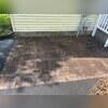 Before soft washing, the paver patio was covered in grime.