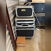 Storage unit cleanout- shop fans,  extension cords, camping gear, backpacks, moving boxes, clothing, lamps, band gear and storage boxes for band equipment, ladders, bench, misc items and junk removed in Southlake, TX