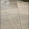 The driveway has uneven slabs that not only don't look good, but also present a safety concern.