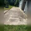 Before cleaning, the concrete pad was heavily covered in grime.
