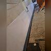 Here you can see the WaterGuard system set in place along the perimeter trench, ready to redirect water before it ever reaches your basement floor.