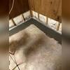 The pipes are placed within the floor and above the soil to prevent clogging.
