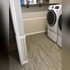 ThermalDry® flooring planks are made from a waterproof, inorganic PVC material with a wood-look finish, designed to resist moisture, prevent mold growth, and feel warmer than concrete in basement environments. They come in various colorways, and this homeowner opted for the gray ones.