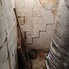 This Burlington, NC basement was showing classic signs of foundation stress and long-term moisture issues. Cracks spread across the cinder block walls, some beginning to bow inward, while visible water damage and efflorescence stained the surface. These issues indicated both structural strain and...