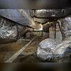 This crawl space in Cary, NC was in rough shape. The floor was bare dirt, insulation was falling from the joists, and ductwork was exposed to moisture and contaminants. Without a vapor barrier or proper drainage, the space was vulnerable to mold, wood rot, and poor air quality inside the home.