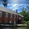 Now it's time for the new shingles! The parish selected IKO Dynasty shingles in Granite Black; a beautiful, bold shade that perfectly complements the church's red brick exterior and white accents. These shingles are proudly backed by Brown Roofing's 50-year warranty.