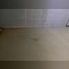 This photo shows the initial signs of foundation settlement inside the home visible cracking across the concrete slab floor. The use of a laser level highlights elevation changes, confirming that the floor had shifted over time. This crack pattern was a clear indicator of underlying structural...