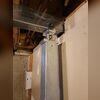 Our crew installed SmartJacks by excavating small sections beneath the sagging floor joists, placing engineered steel piers on stable soil or concrete footings, and adjusting them to provide immediate support and lift.