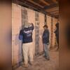 Our crew begins surface preparation before applying CarbonArmor, ensuring a strong, lasting bond to the basement wall.