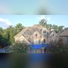 The storm damage that occurred was nearly catastrophic. The peak of the roof was nearly torn off and the storm has left the home exposed.