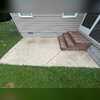 Before the wash, this concrete patio was covered in years of built-up grime.