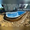 Our crew started by removing the existing patio and digging around the pool.