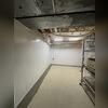 This once dark, cluttered basement was turned into a bright, clean and waterproofed space!