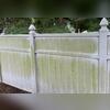 Before the soft wash, this vinyl fence was coated in algae and mildew.