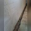 Our team carefully excavated a trench along the basement footing to prepare for the drainage system installation.