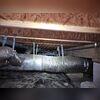 During inspection, moisture damage can be seen in the crawl space.