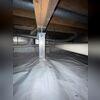 Our crew carefully assessed the crawl space to identify sagging or weakened floor joists, then strategically installed adjustable SmartJacks beneath them. These durable steel supports were anchored to stable footings and precisely adjusted to lift and level the floor, restoring structural integrity...