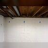 Cracks in this homeowner's basement walls were a clear sign of foundation settlement, caused by shifting or sinking soil beneath the home. As the foundation moved, it created pressure and stress on the basement walls, leading to visible cracking. It's crucial to address these issues early, as...