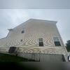 Before soft washing the vinyl siding on this home was covered in years of built up grime.