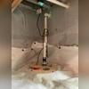 A sump pump system was set in place to remove groundwater and prevent standing water from damaging the foundation.