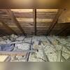 Our high-powered vacuum will suck out all this insulation. First we need to remove the larger debris by hand.