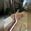 In this Burlington, NC project, roof runoff was pooling near the foundation, creating risks for water intrusion and soil erosion. Our team installed a buried downspout extension to carry water away from the home's foundation and disperse it at a safe distance. This foundation drainage solution...