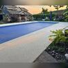 The newly installed Sugar Lake Durastone gives this Eau Claire pool deck a bright, slip-resistant, and elegant finish, perfectly complementing the backyard oasis.