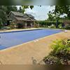 The original concrete pool deck had visible wear and discoloration, prompting the homeowner to explore a long-lasting, attractive resurfacing solution.