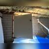 Interior view of the crawlspace access point in Prescott, AZ after encapsulation, showing the CleanSpace barrier extending seamlessly to the entry for complete protection.