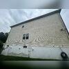 The vinyl siding on this home was covered in years of grime before our soft wash service.