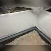 CleanSpace is applied to the walls to keep the humidity from affecting the structure of the basement. WaterGuard was applied under the floor slab to collect water seeping into the basement and direct it to the sump pump.