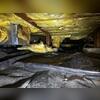 This crawl space is filled with fallen fiberglass insulation, standing water and a lot of rodent droppings.