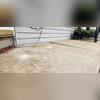 This photo highlights the problem area prior to repairs. The sinking slab was causing water to pool around the homes foundation. This isn't just an eyesore; it's a serious drainage problem that can lead to severe damage.