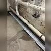 In order to install WaterGuard, our crew created a perimeter trench, then placed the drainage channel inside directly on top of the foundation footing to avoid potential clogs. Next, the system was surrounded with clean washed stone and a layer of cement was applied, leaving a clean finish.