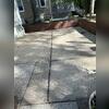 A clear tripping hazard caused by a settled concrete section.