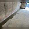 WaterGuard is installed along the perimeter of the basement floor and covered in fresh concrete to provide a seamless finished look. The WaterGuard Port is left visible to provide access to the system when needed.