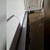 This photo shows the WaterGuard track in position, giving a behind-the-scenes look at how basement water gets stopped at the source.