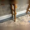 WaterGuard was installed against the wall to collect water from the walls and floors to drain any flooding to the sump pump.