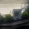 This outdoor unit is virtually silent. The air discharges horizontally so leaves and junk don't fall into it. We raised it up off the pad to keep it out of the mulch and snow. You can also see the termination of the PVC vent pipes from the furnace to the left of the heat pump. Looks great and works...
