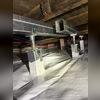 SmartJacks support metal beams running the length of the home, raising the floor back where it should be.