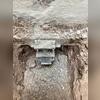 To help support the house because it has shifted, helical piers were installed against the house's foundation. These piers are screwed into the ground until they are deep enough to fully support the house.