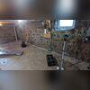 The damp basement before the waterproofing project.