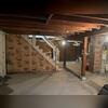 This Cooperstown basement had water stains on the floors due to leaking.