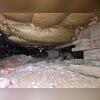 The paper-backed insulation up in the floor joists needs to be removed. This will not do anything for a home, as the thermal break (insulation) needs to be where outside air meets inside- which would be the foundation walls and headers.